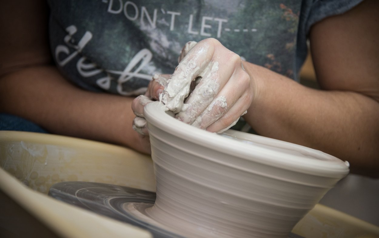 shaping clay with hands